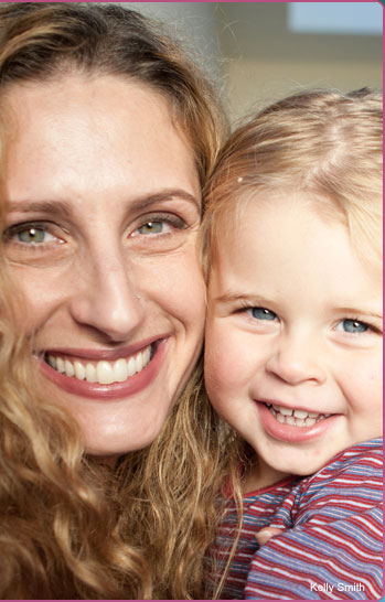 Mary Hohlman and child smiling for camera